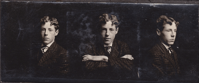 A photo of a young man in a stylish suit.