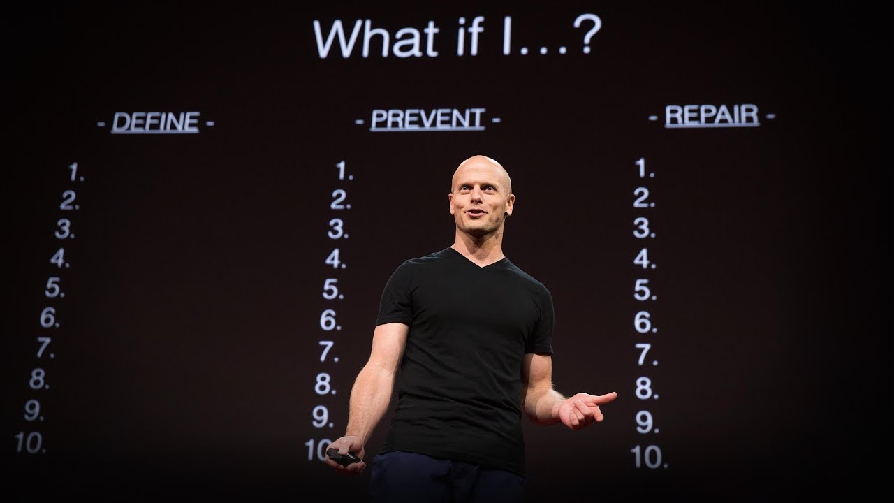 A man standing in front of a screen with numbers on it, potentially related to SEO.