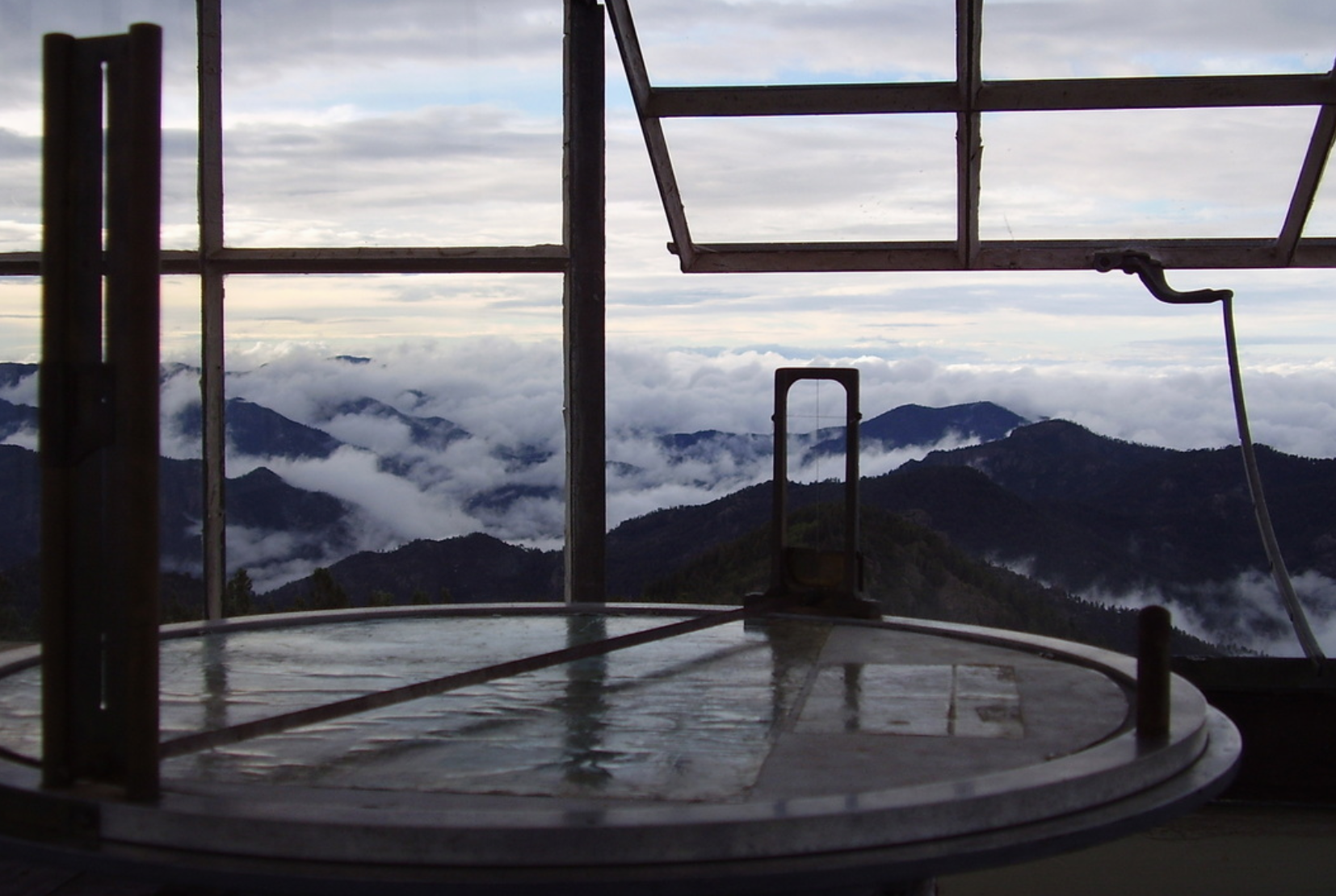A cloudy sky over a mountain, offering solitude.