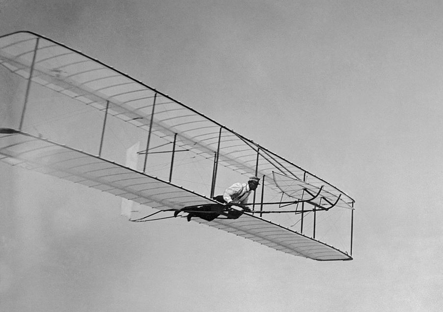 A man in a plane flying through the air with discipline and motivation.