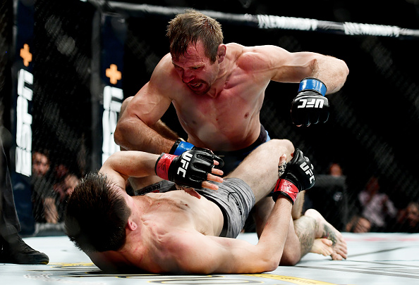 Two fighters are battling it out in the heart of the ring.