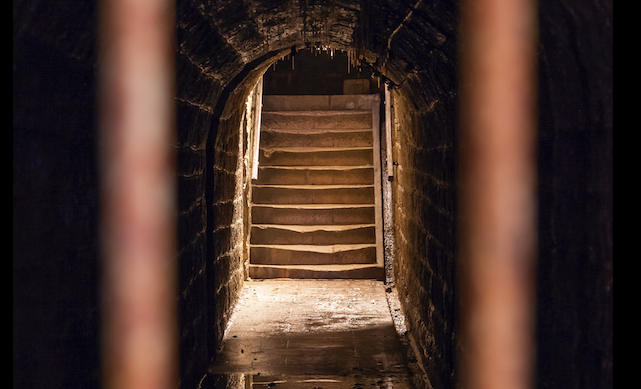 A stairway leading into a dark tunnel, perfect for a podcast exploring soul.