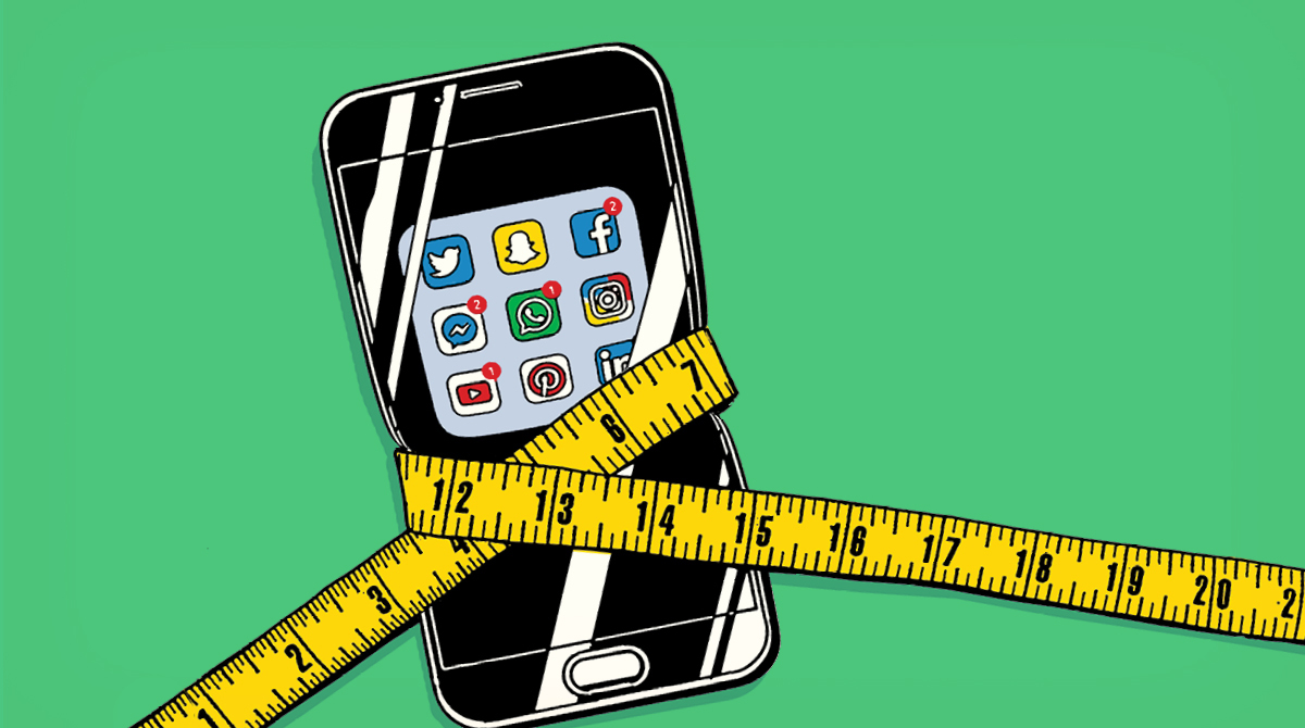 A smartphone with a measuring tape around it, perfect for tracking social media trends.