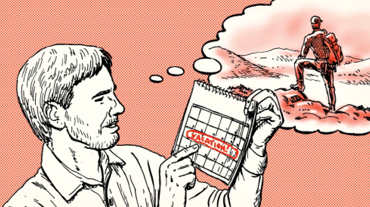 A man is checking a calendar with a mountain in the background.