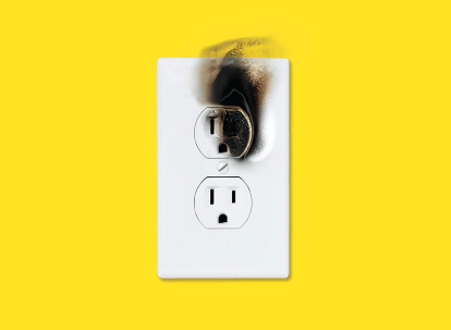 A white outlet with a fire on it on a yellow background, showcasing the potential catastrophes that can arise.