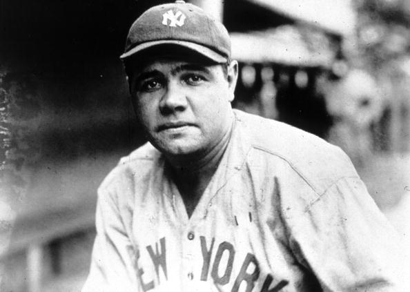 A vintage photo of a baseball player in black and white.
