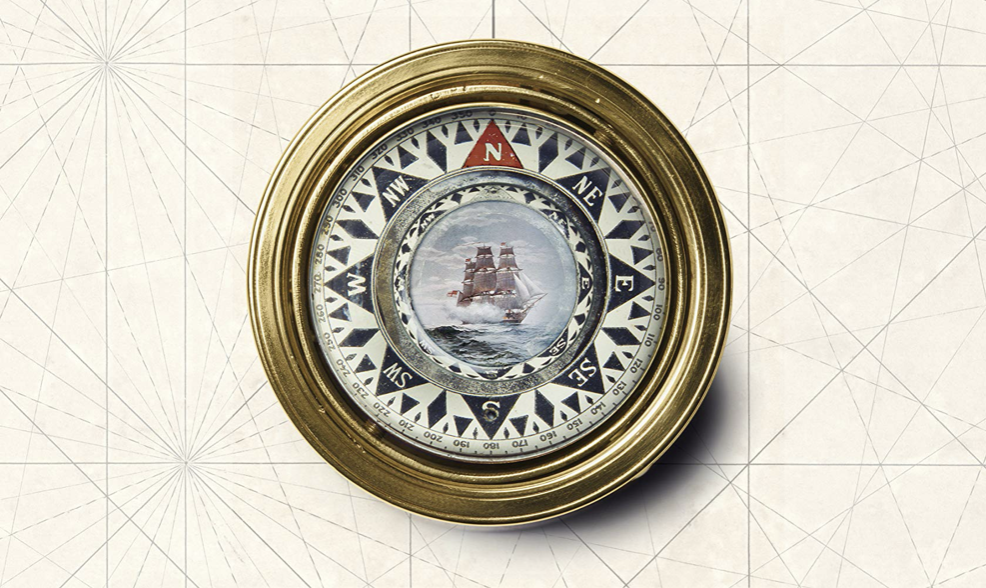 A gold frame with a picture of a ship, evoking thoughts of adventure and journey.