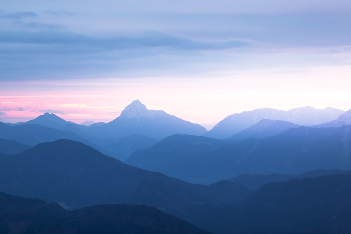 A mountain range in the stillness of dusk.