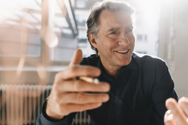A man holding a cigarette, secrets.